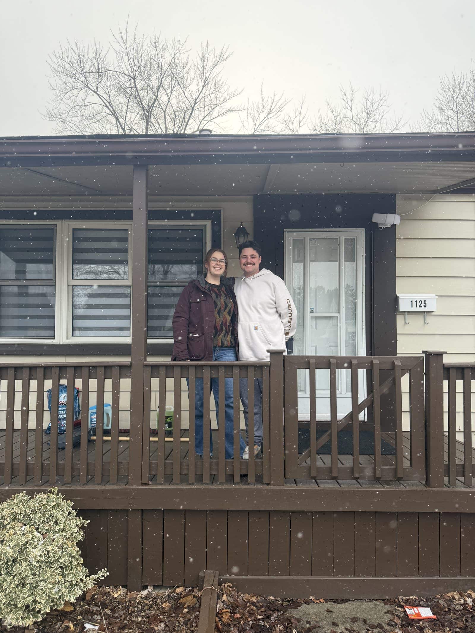 Clients on the front porch of the home they bought in Windsor-Essex