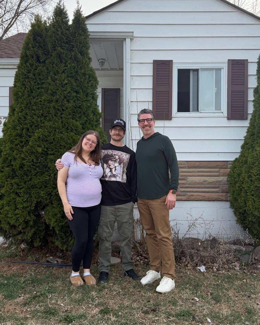 Matt Biggley with clients outside their Windsor-Essex home