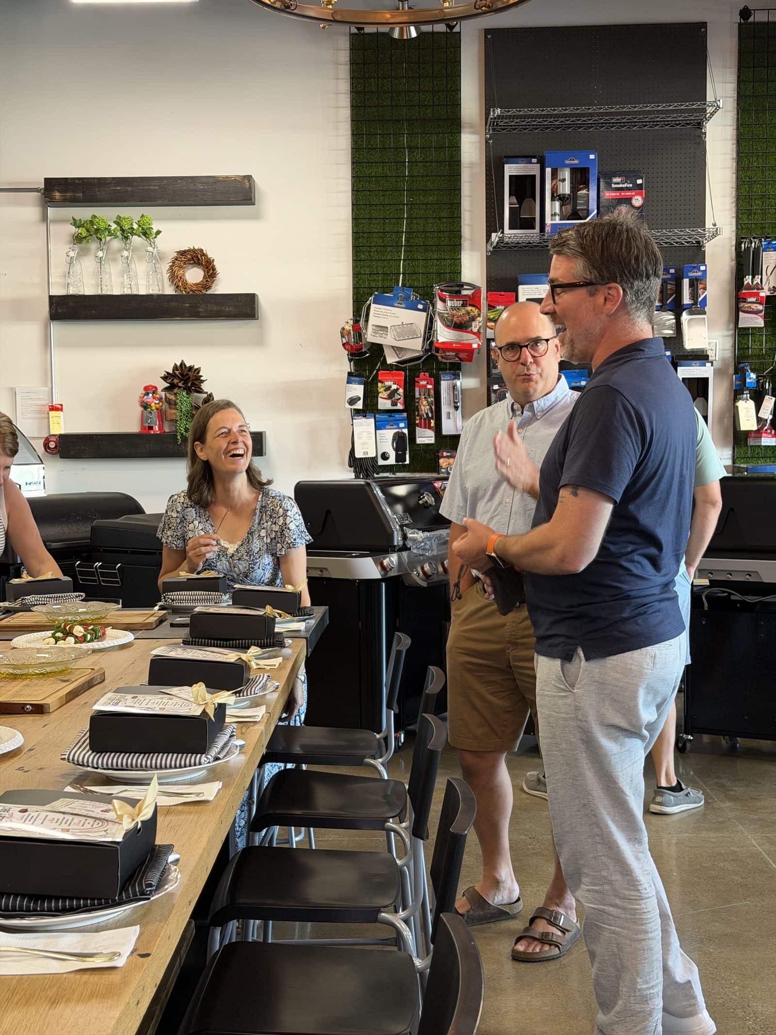 Matt Biggley talking with guests at a client appreciation event