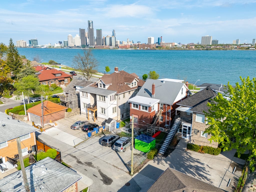 Aerial view of 1441 Riverside Drive East with the Detroit River and skyline beyond