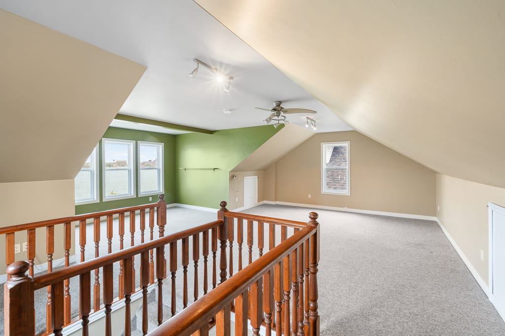 Large third-floor loft with original stair railing