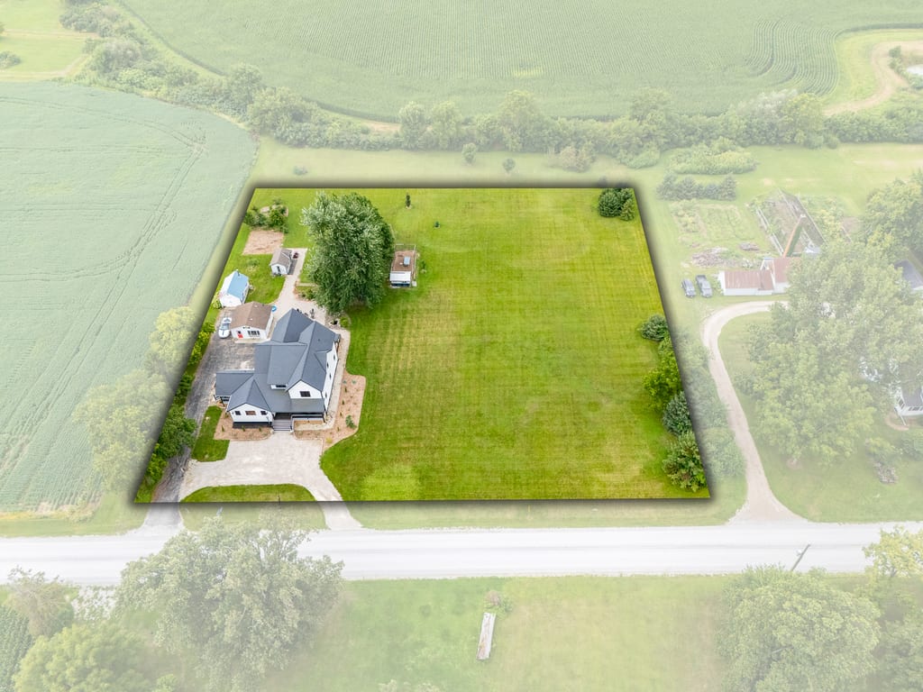 Aerial view of the 1.82 acre property boundary showing the house, lawn, and outbuildings