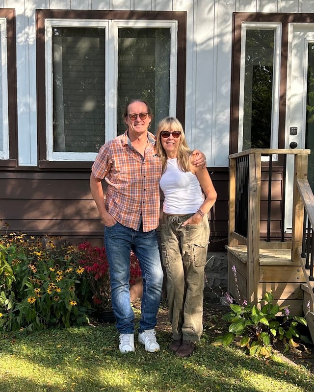 A couple outside their home in Windsor-Essex