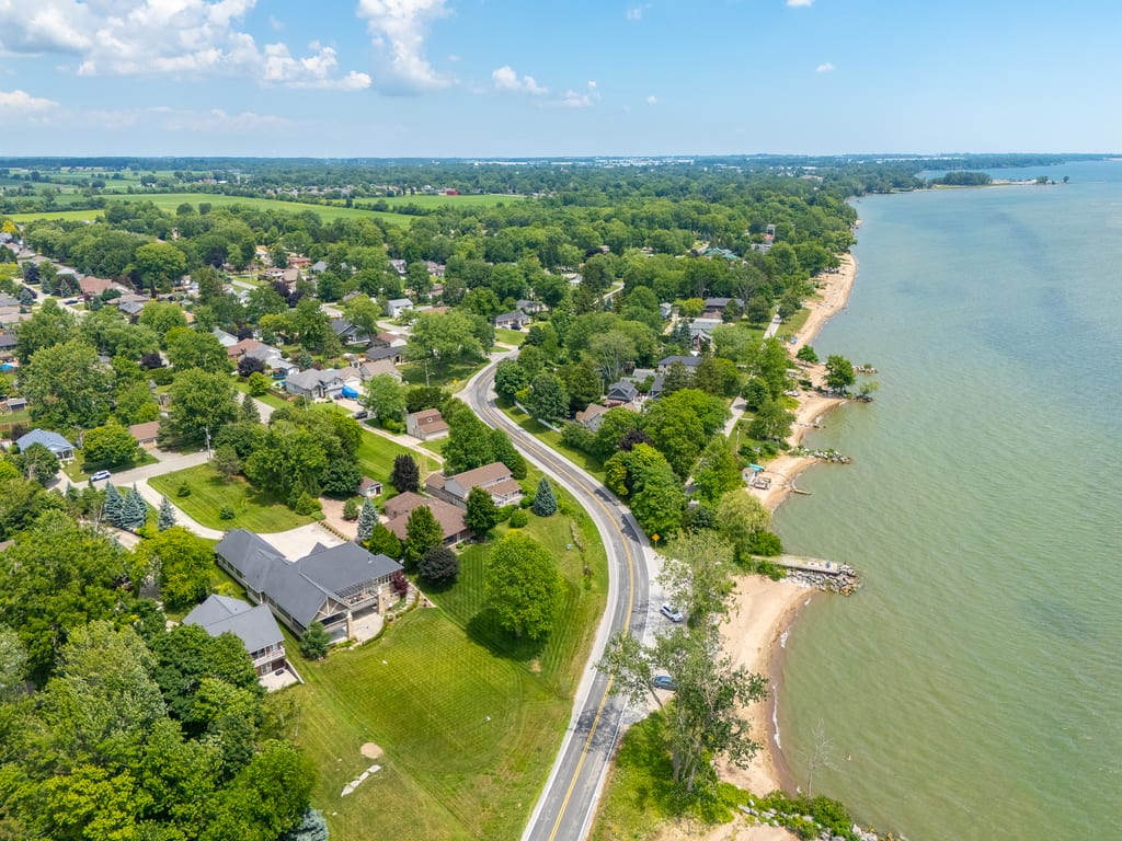 Aerial view along the Lake Erie shoreline showing the beach and neighbouring properties