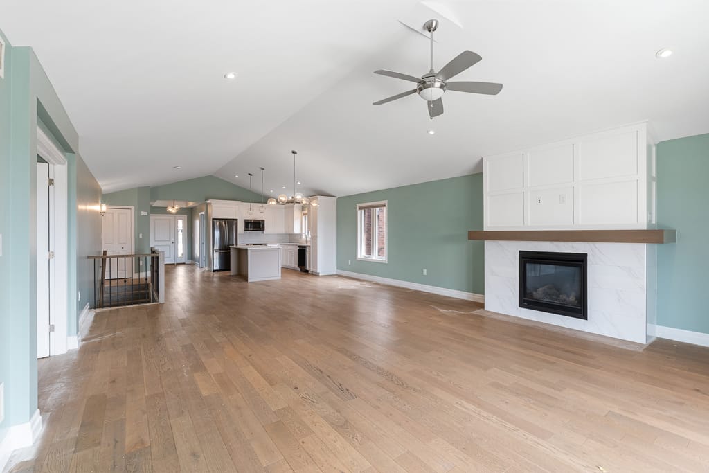 Open-concept main floor seen from the living room toward the dining area and kitchen