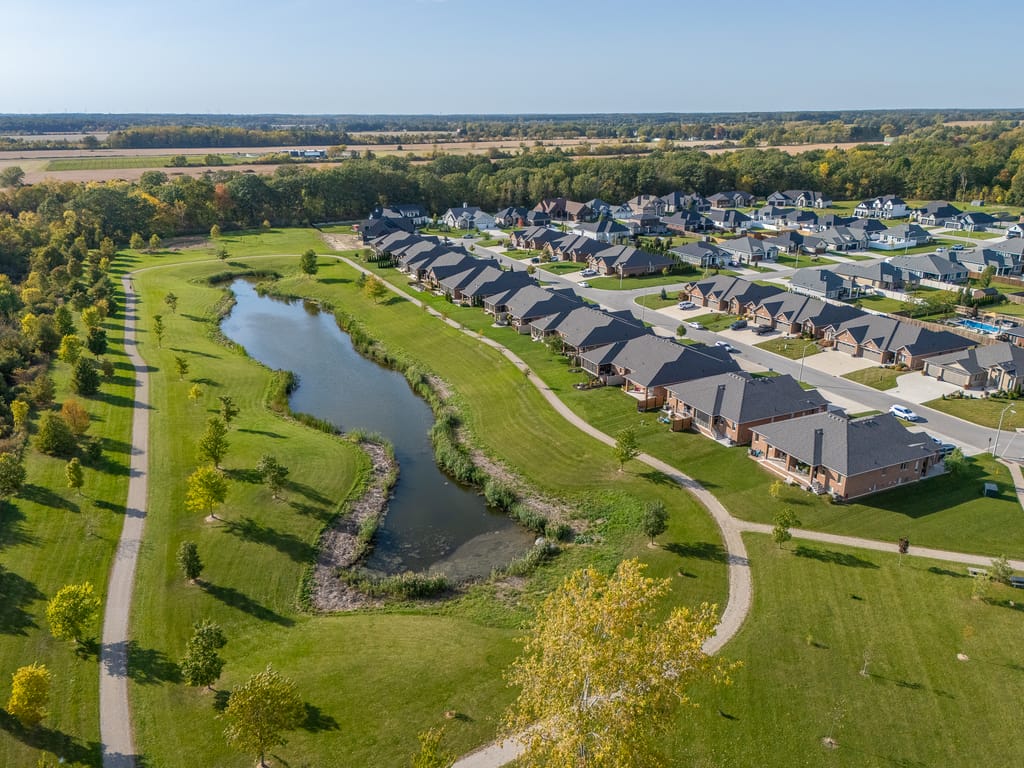 Aerial view of the walking trail and pond along the edge of the neighbourhood