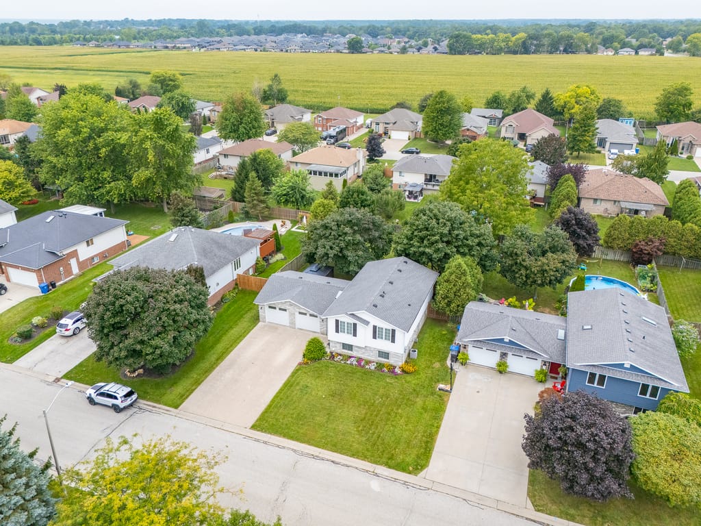 Aerial view of the house on Lawndale Avenue among neighbouring homes and yards