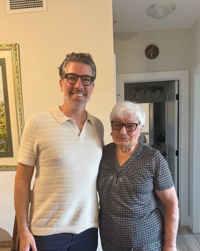 Matt Biggley standing with a client inside her home in Windsor-Essex